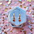 Gold Huggies with January Birthstone Charm