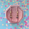 Gold Huggies with February Birthstone Charm