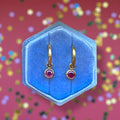 Gold Huggies with July Birthstone Charm
